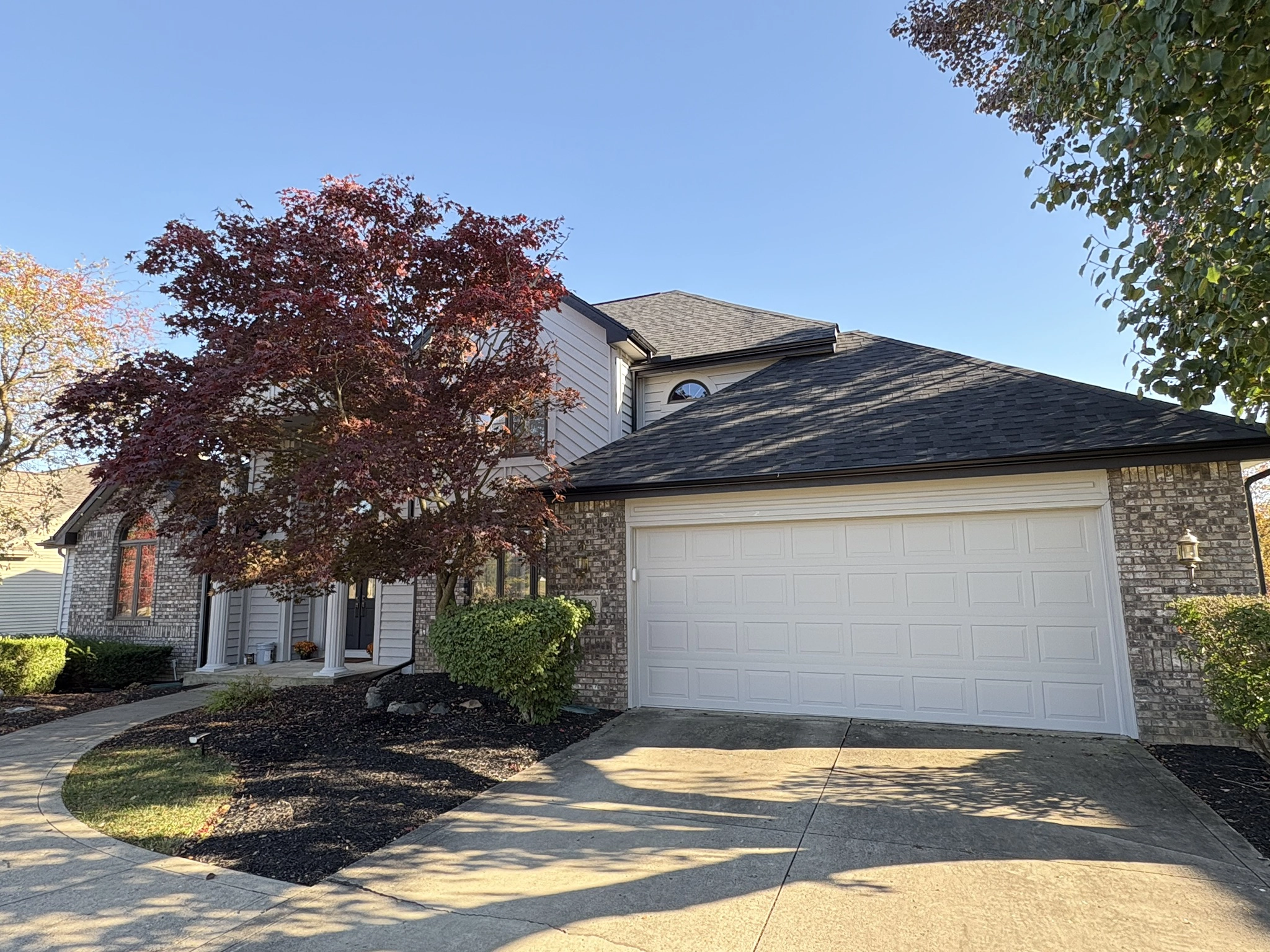 Home with new roof and landscaping