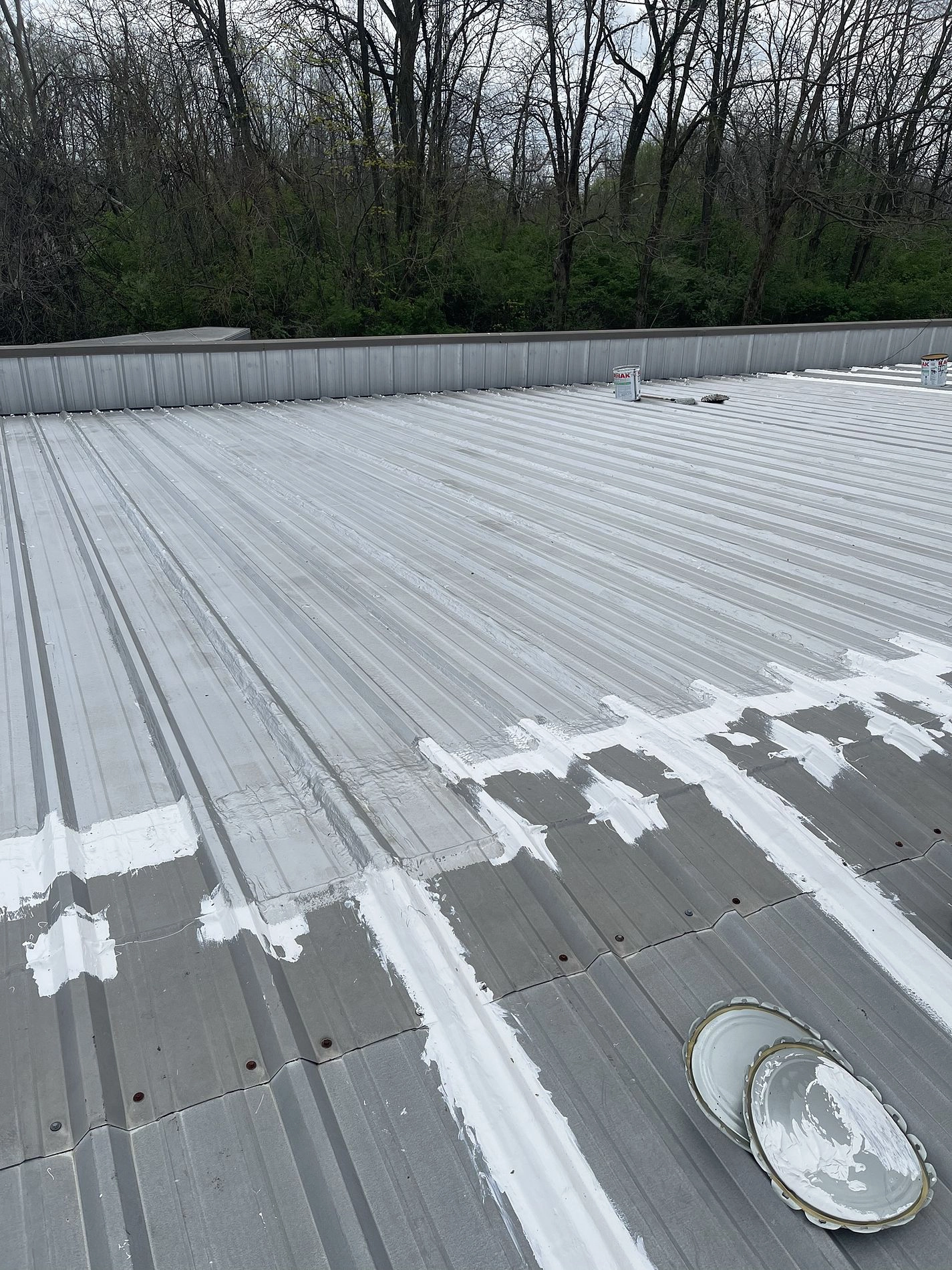 Roof coating in progress
