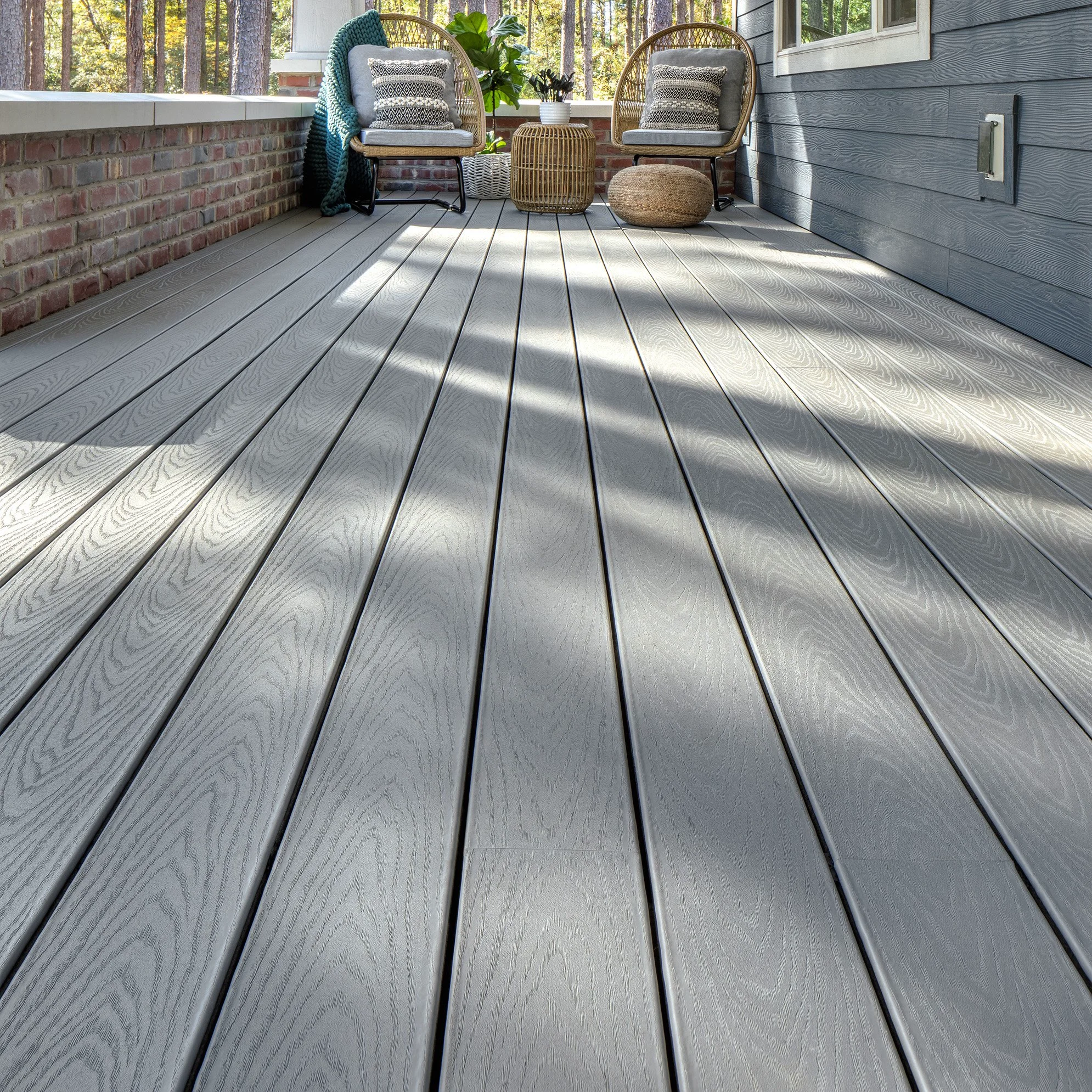 Gray composite decking with wood grain texture