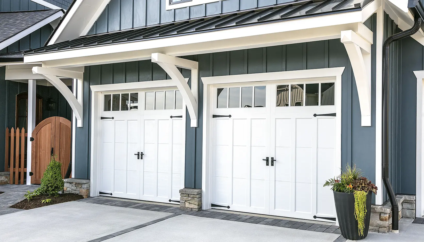 White carriage style garage doors on home