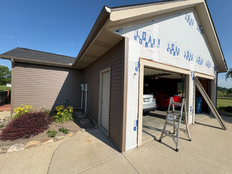 Storm-damaged siding requiring insurance claim replacement